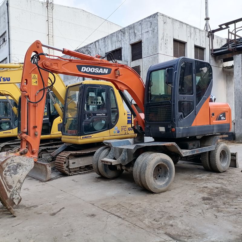 5 ton Korea diimpor 90% baru Doosan DX 60W bekas Excavator Roda dengan kualitas tinggi dan kinerja terbaik untuk dijual